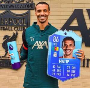 Joel Matip with the premier league player of the month award for March